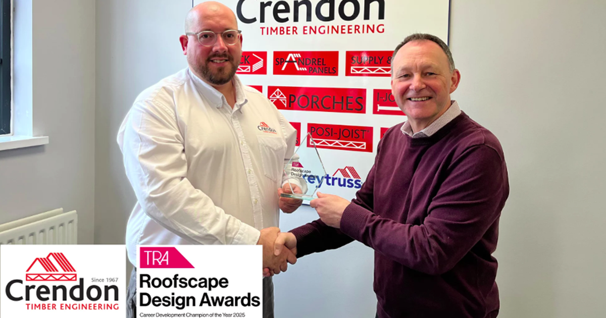 Two members of staff at Crendon shaking hands